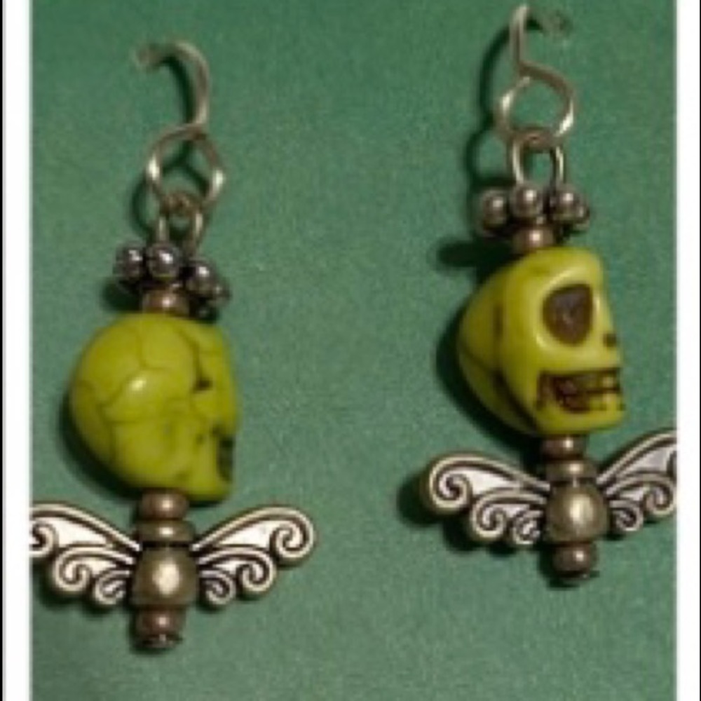 Green skull earrings.